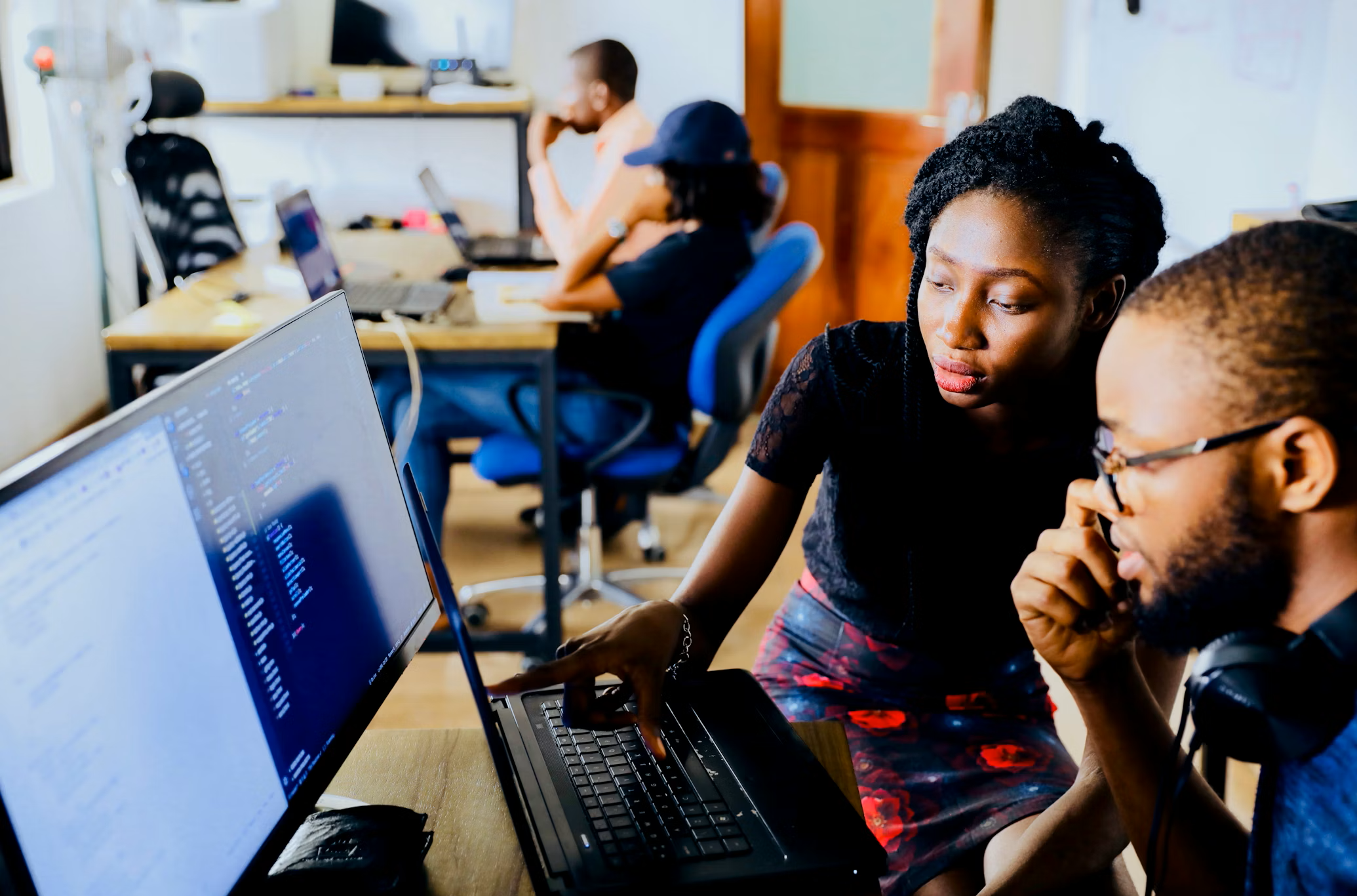 Two students looking at a computer screen